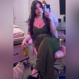 Green romper with lace and gold details